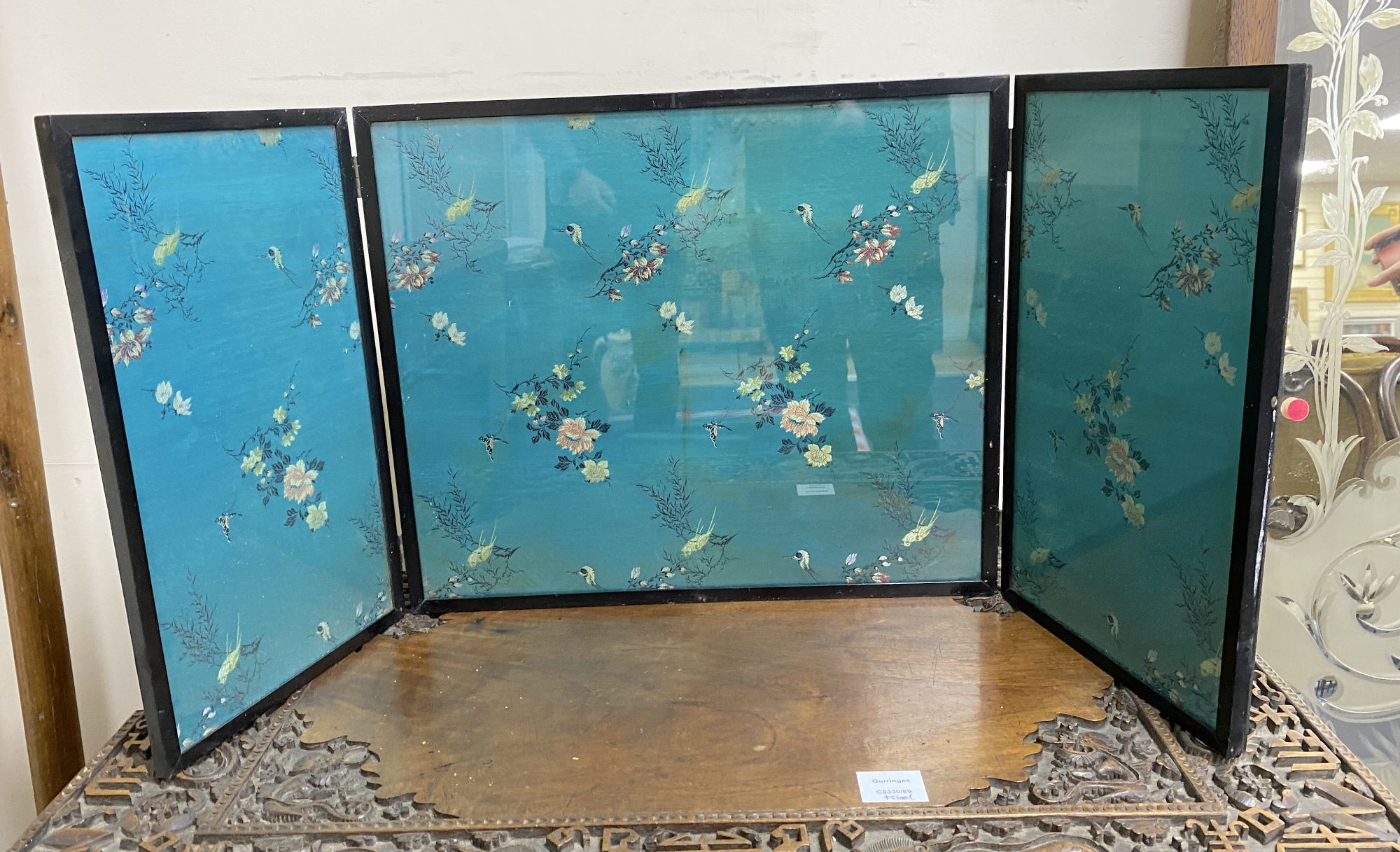 A Chinese embroidered silk inset three fold screen, largest panel 40 x 47cm